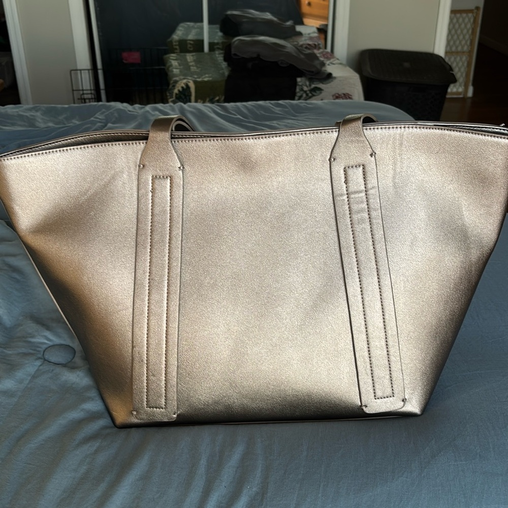 This is a silver tote from Lord and Taylor.